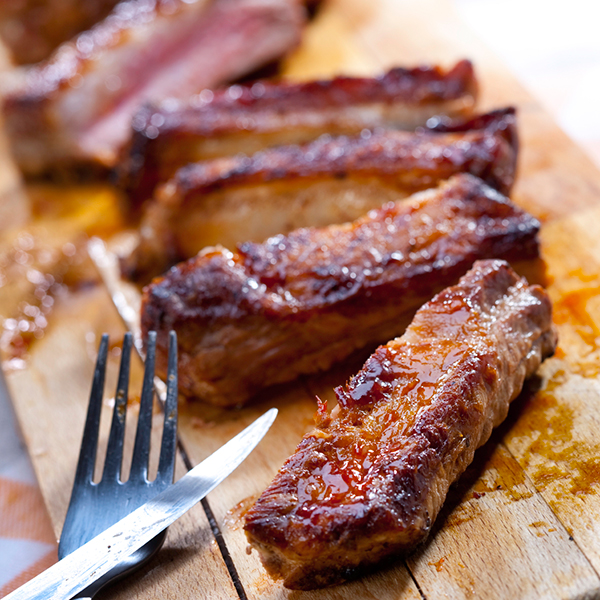 roasted spareribs on a cutting board