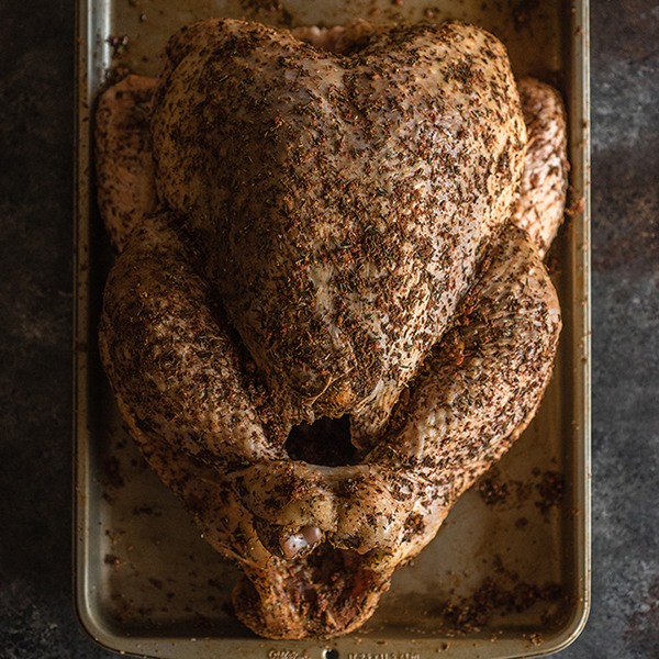 turkey ready to be roasted on a sheet pan