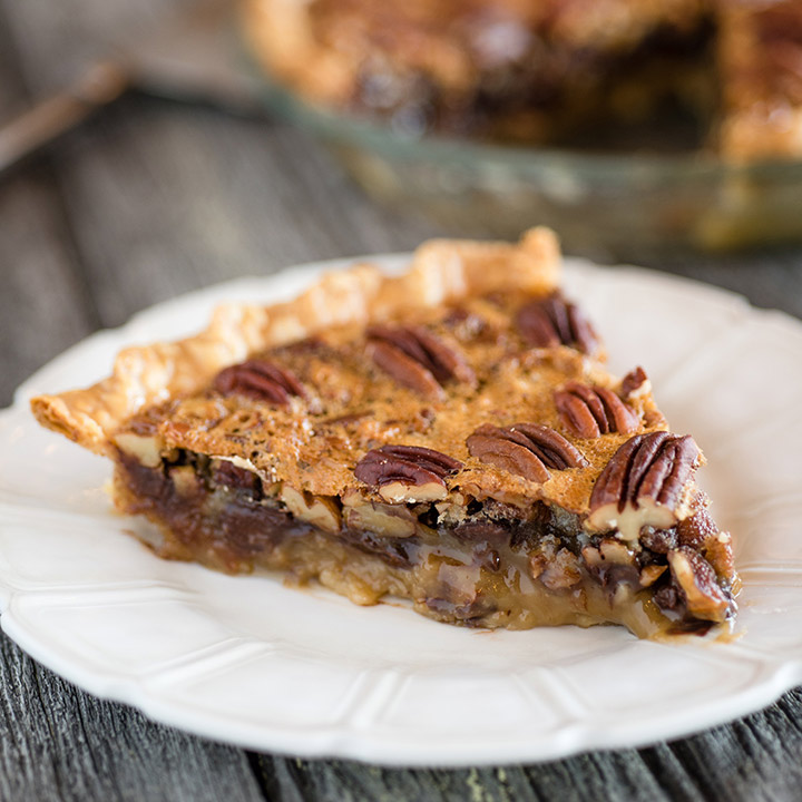 chocolate bourbon pecan pie slice on a plate