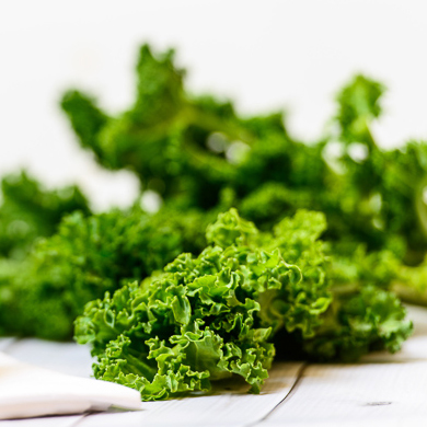 fresh kale on a white table