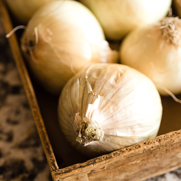 whole onions in a wooden box