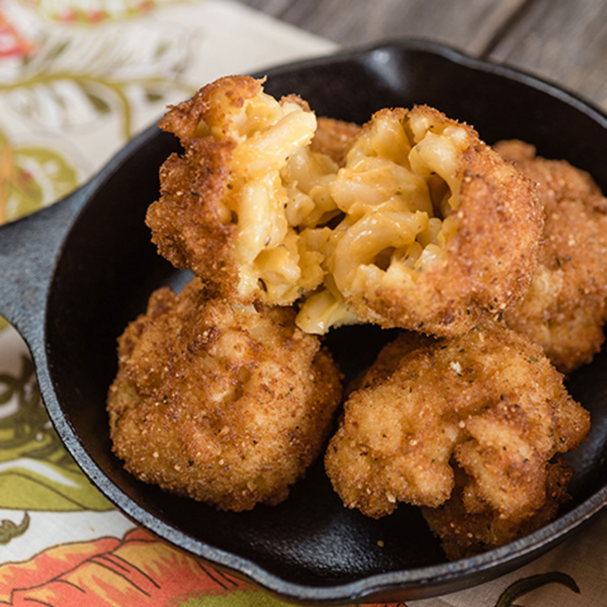 deep fried macaroni and cheese balls in a bowl